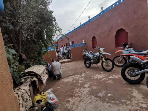 a group of motorcycles parked next to a building at Riad Dades Birds in Boumalne Dades