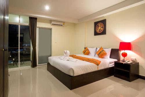 Voodi või voodid majutusasutuse The Elegant Patong toas