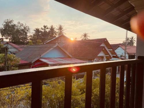 a view of a house from a balcony at Moonlight Champa Riverview in Luang Prabang