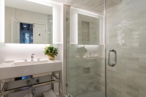 a bathroom with a sink and a shower at 20 South Battery in Charleston