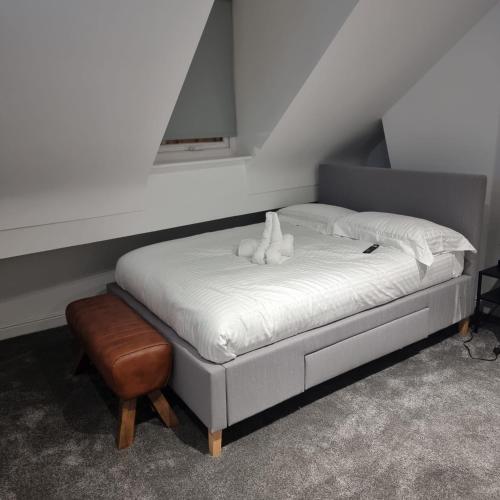 Ένα ή περισσότερα κρεβάτια σε δωμάτιο στο Prescot Rooms