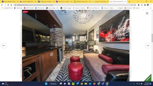 a living room with a couch and a table at Holiday Inn Desert Club Resort in Las Vegas