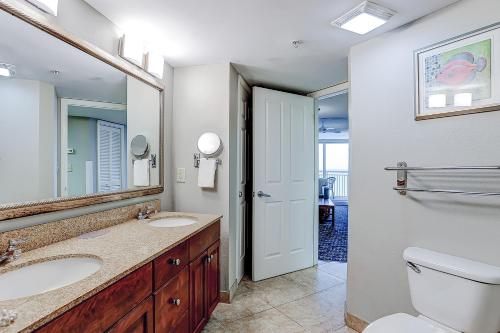 a bathroom with two sinks and a toilet at Ocean Blvd Resort, Unit #1234 in Myrtle Beach