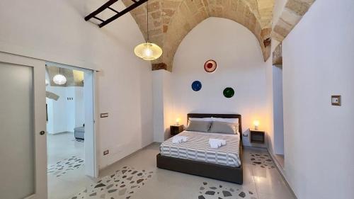 Postel nebo postele na pokoji v ubytování Vico Sauro Apartament