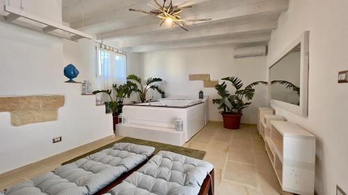 a large living room with a couch and a sink at Vico Sauro Apartament in Veglie