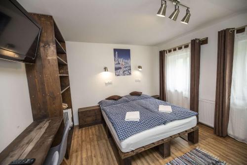 Postel nebo postele na pokoji v ubytování Chata Orlik - all inclusive & wellness