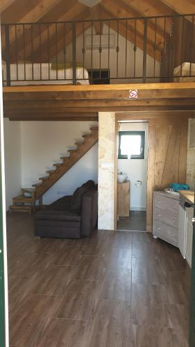 a room with a loft with a bed and a couch at Villa Maslina Šarić in Ðevrske