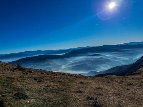 a view from the top of a mountain with the sun at Vila Bašić Vlašić Apartman MEDO in Vlasic