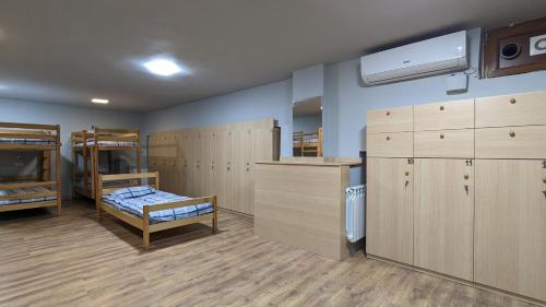 a room with bunk beds and a room with a bed at Time Hotel & Tours in Yerevan