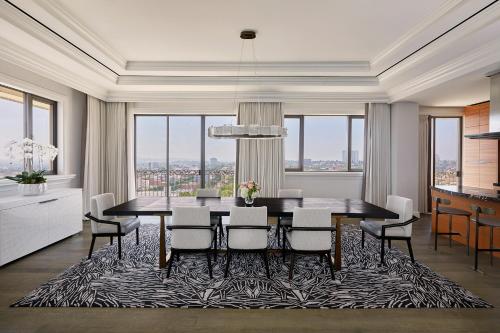 a dining room with a table and chairs at Beverly Wilshire, A Four Seasons Hotel in Los Angeles