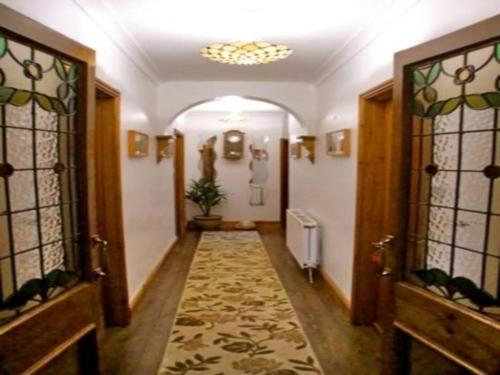 a hallway in a building with a hallwayngth at Eden's Rest Bed and Breakfast in St Austell