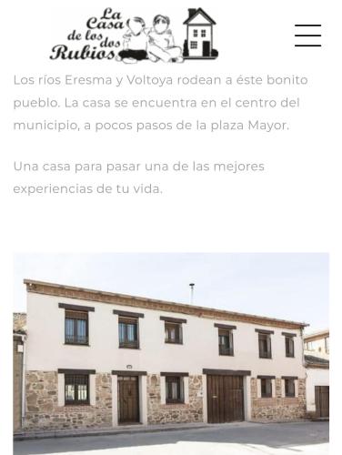 a screenshot of a website with a white building at La Casa de los Dos Rubios in Nava de la Asunción