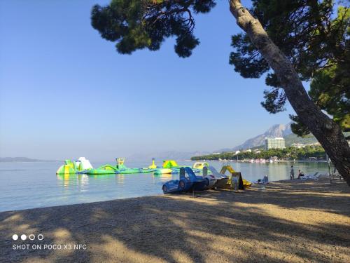 a group of boats in the water at a beach at Villa Radić in Makarska