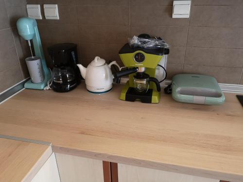 a counter top with a coffee maker and appliances on it at Serres Kavafi 7 city center , FREE PARKING , FREE NETFLIX in Serres