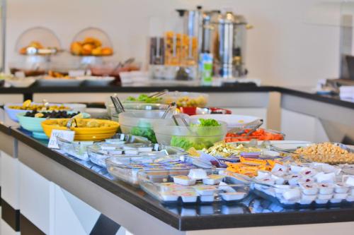 a buffet of food on a counter in a kitchen at Ahsaray Hotel in Aksaray