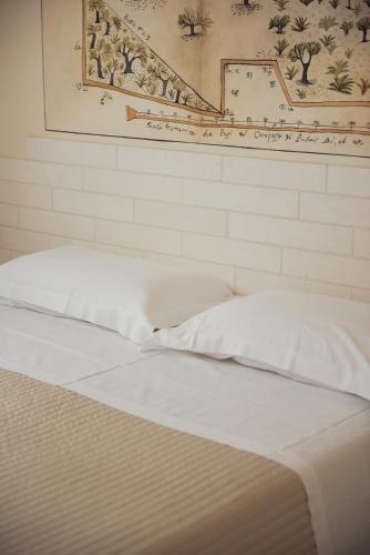 Postel nebo postele na pokoji v ubytování Corte Di Ferro Hotel & Wellness Resort