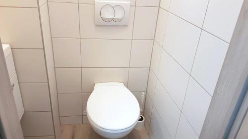 a small bathroom with a white toilet in it at Neuburg Apartment am Schloss in Neuburg an der Donau