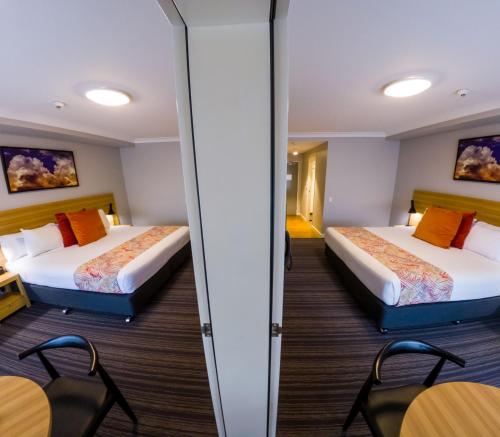 Potters Toowoomba Hotelにあるベッド