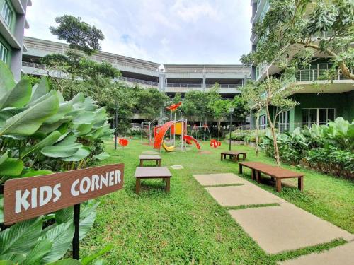 a school yard with benches and a playground at Ipoh All Suite Resort, Jalan Haven Ipoh in Ipoh