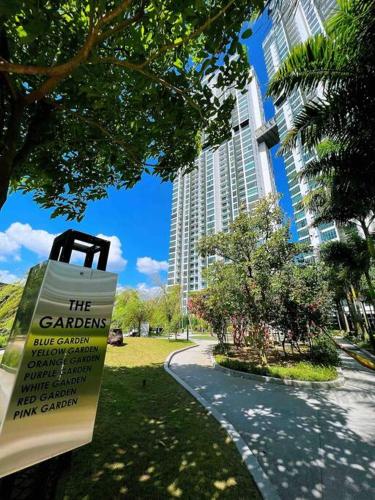 a sign in a park in front of a building at A2801 Green Haven 4Bedroom netflix100mbps By STAY in Masai