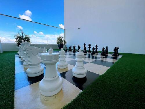 a large chess board with a giant chess at A2801 Green Haven 4Bedroom netflix100mbps By STAY in Masai