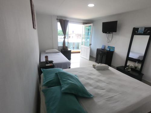 Postel nebo postele na pokoji v ubytování Apartamentos Sweet Island