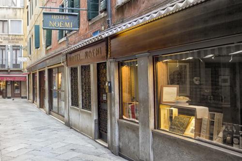 a store front of a building with a street at Hotel Noemi in Venice