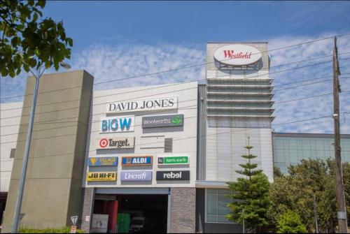 a building with signs on the side of it at Sandy Hill apartment, Sandringham in Sandringham