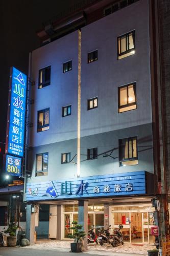 a large building with a sign on the side of it at Shan Shui Hostel in Hualien City