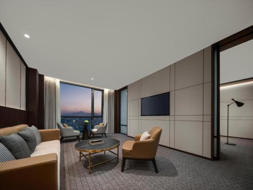 Χώρος καθιστικού στο Grand New Century Hotel Wenzhou