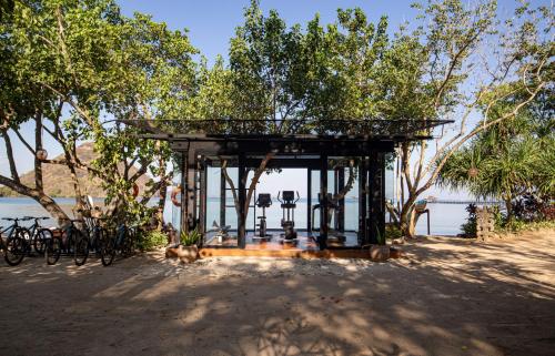 a pavilion with bikes parked next to the water at Plataran Komodo Resort & Spa - CHSE Certified in Labuan Bajo