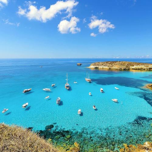 a group of boats in a large body of water at B&B Stella del Mare in Lampedusa