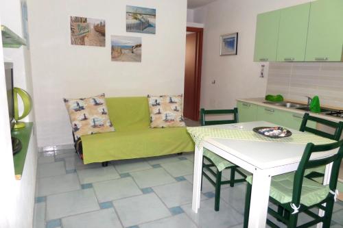 a living room with a couch and a table at The Blue Lighthouse in SantʼAntìoco