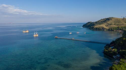an aerial view of a large body of water with boats at Plataran Komodo Resort & Spa - CHSE Certified in Labuan Bajo