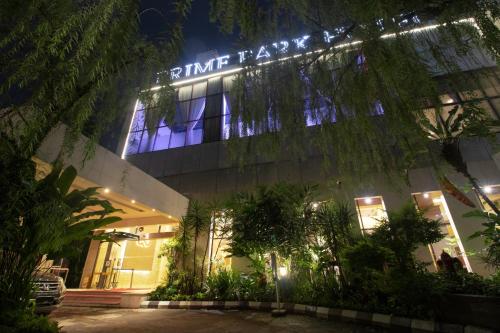 a building with a sign on it at night at PRIME PARK Hotel Bandung in Bandung