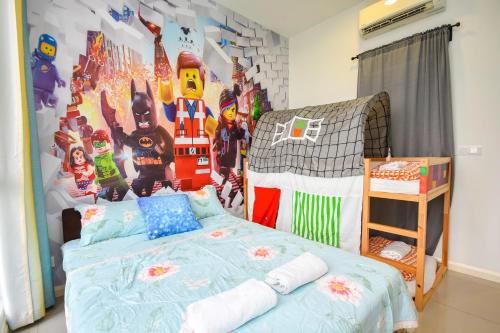 a bedroom with a bed with a superhero mural at D'Pristine Theme Suite by Nest Home at LEGOLAND in Nusajaya