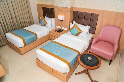 The Elegance Hotelにあるベッド