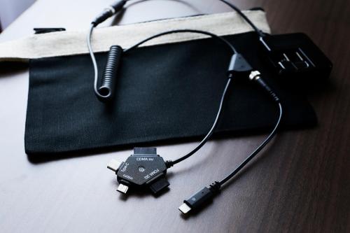 a black bag with a charger on a table at Hotel Intergate Tokyo Kyobashi in Tokyo
