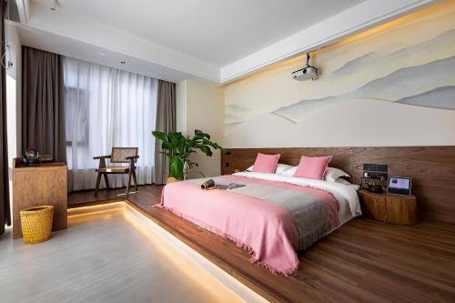 Postel nebo postele na pokoji v ubytování Cheng Jin Hotel