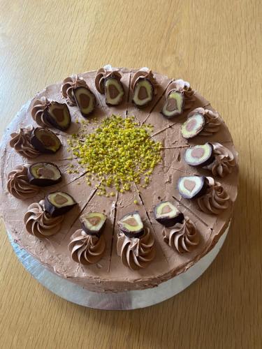 a chocolate cake sitting on top of a table at Restaurant-Café-Pension Himmel in Landshut
