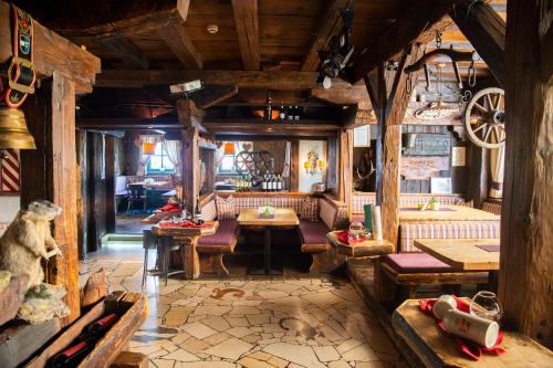 a living room with couches and tables in a cabin at Sporthotel Radstadt in Radstadt