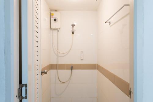 a bathroom with a shower with a shower head at BW Thai Art Style Hotel in Bangkok