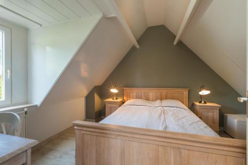 Postel nebo postele na pokoji v ubytování Vakantiewoning Domburg dichtbij strand, Kanonweistraat 12a