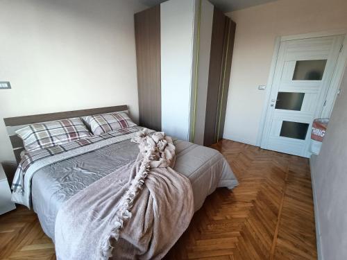 En eller flere senge i et værelse på Diva Apartment