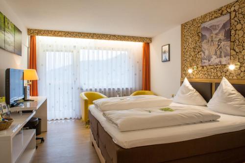 En eller flere senge i et værelse på Hotel Sonnenblick
