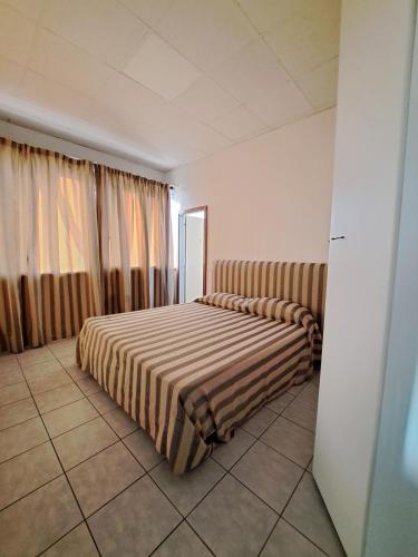 Postel nebo postele na pokoji v ubytování RTA Albergo Malatesta