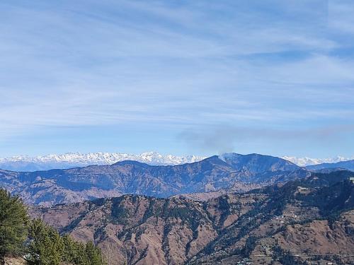 a view of a mountain range with snow capped mountains at Fortune Park Kufri, Shimla - Member ITC Hotels' Group in Shimla
