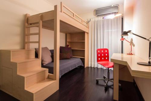 a bedroom with a bunk bed with a desk and a desk at Athens Plaka Hill luxury Flat in Athens