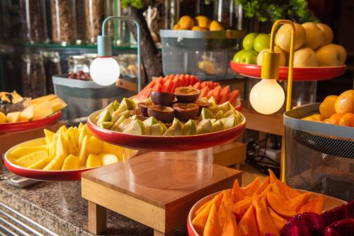 a buffet with several plates of fruit on display at Futian Shangri-La, Shenzhen,Near to Shenzhen Convention&Exhibition Centre, Futian Railway Station in Shenzhen