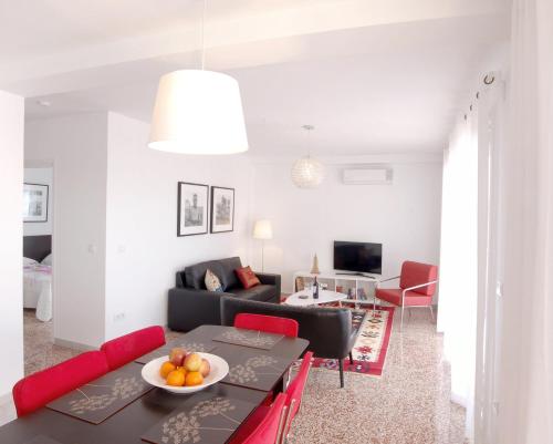 a living room with a couch and a table at Casa Malaga in El Palo